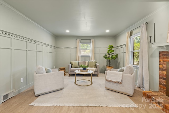 1024 Regency Dr, Charlotte, NC 28211 - living room with a decorative wall, ornamental molding, wood finished floors, and wainscoting