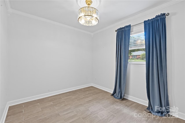 1024 Regency Dr, Charlotte, NC 28211 - unfurnished room with ornamental molding, a chandelier, and wood finished floors