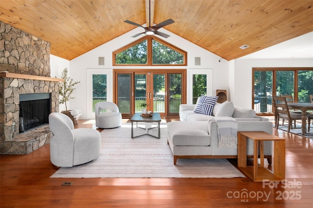 6259 River Cabin Ln, Charlotte, NC 28278 - living area featuring ceiling fan, a stone fireplace, wooden ceiling, high vaulted ceiling, and healthy amount of natural light