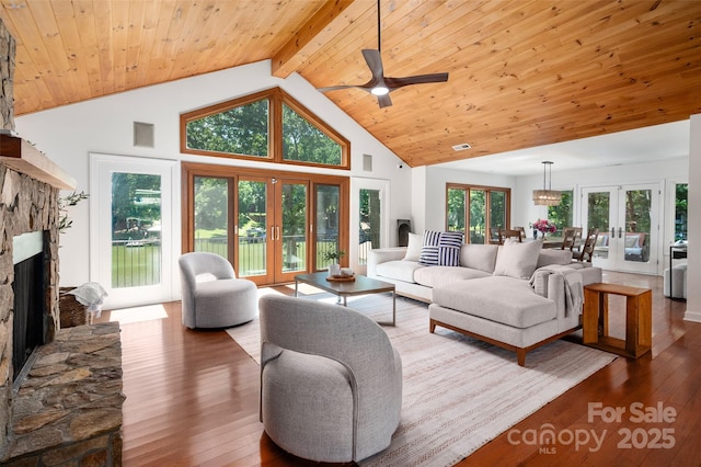 6259 River Cabin Ln, Charlotte, NC 28278 - living room with french doors, a stone fireplace, hardwood / wood-style flooring, high vaulted ceiling, and ceiling fan