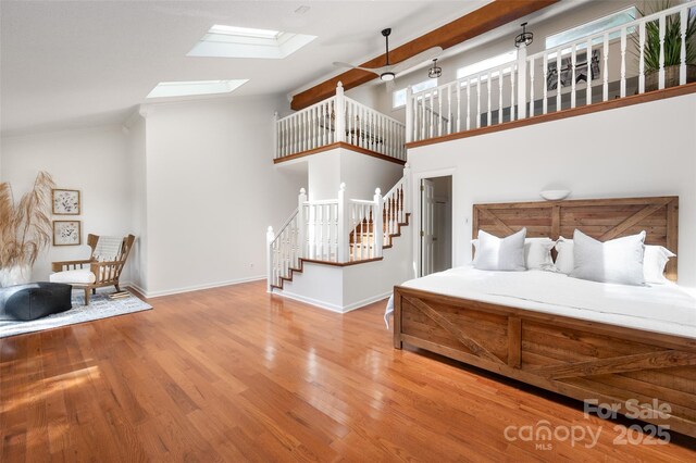 6259 River Cabin Ln, Charlotte, NC 28278 - bedroom with a skylight, wood finished floors, and crown molding