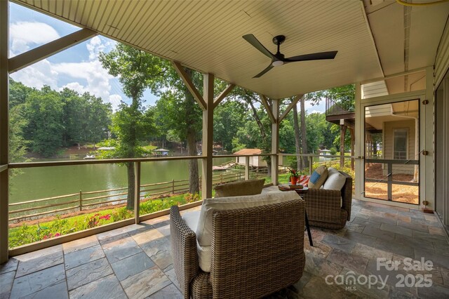 6259 River Cabin Ln, Charlotte, NC 28278 - view of patio with a water view, a ceiling fan, view of scattered trees, and outdoor lounge area
