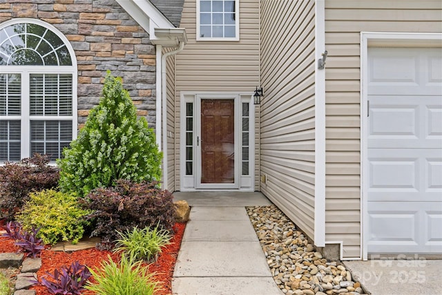 516 Cool Creek Dr, Rock Hill, SC 29732 - view of exterior entry with stone siding and an attached garage