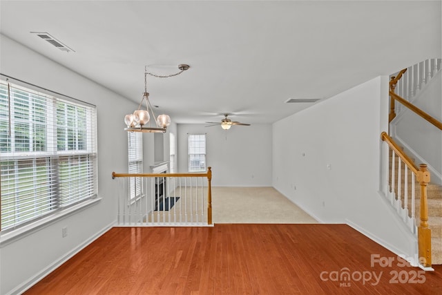 516 Cool Creek Dr, Rock Hill, SC 29732 - empty room featuring a ceiling fan, wood finished floors, and a chandelier