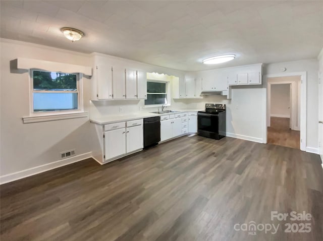 7812 Old Concord Rd, Salisbury, NC 28146 - kitchen with stainless steel electric stove, dishwasher, white cabinets, light countertops, and dark wood-type flooring
