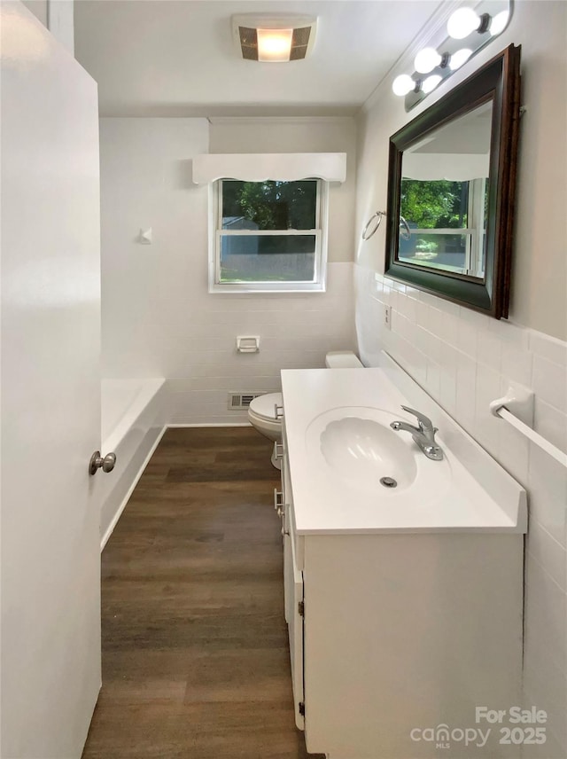 7812 Old Concord Rd, Salisbury, NC 28146 - full bath with tile walls, vanity, wood finished floors, and a bath