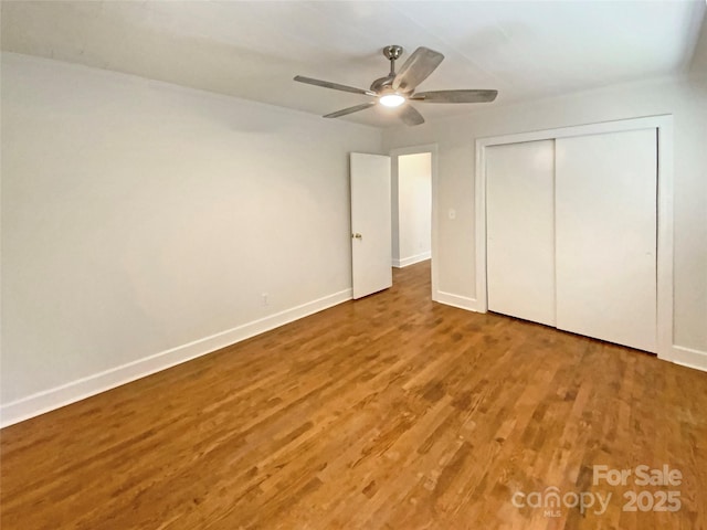 7812 Old Concord Rd, Salisbury, NC 28146 - unfurnished bedroom featuring wood finished floors, a closet, and a ceiling fan