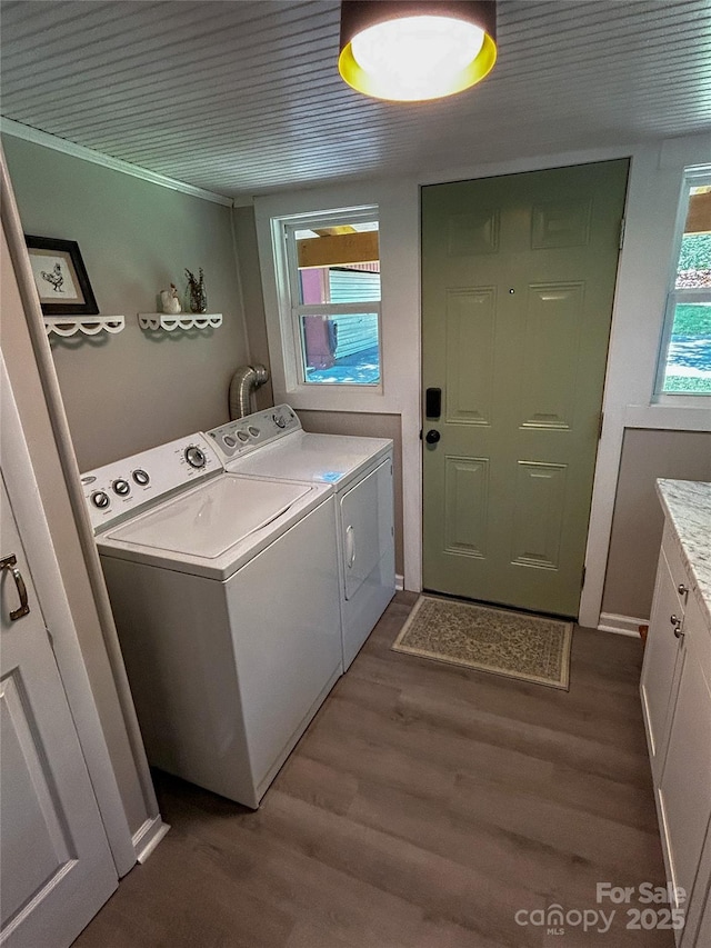 107 Byrd St, Morganton, NC 28655 - laundry room featuring washer and clothes dryer, dark wood-type flooring, and cabinet space
