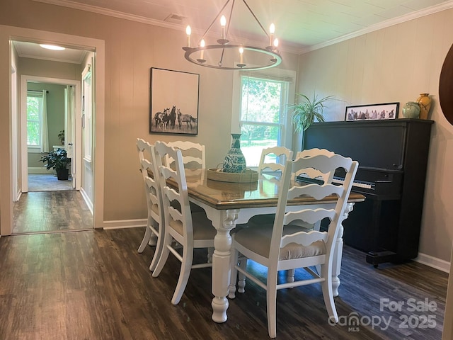 107 Byrd St, Morganton, NC 28655 - dining space featuring dark wood finished floors, a chandelier, healthy amount of natural light, and ornamental molding