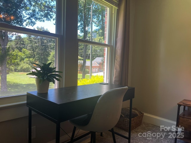 107 Byrd St, Morganton, NC 28655 - dining room with healthy amount of natural light and carpet floors