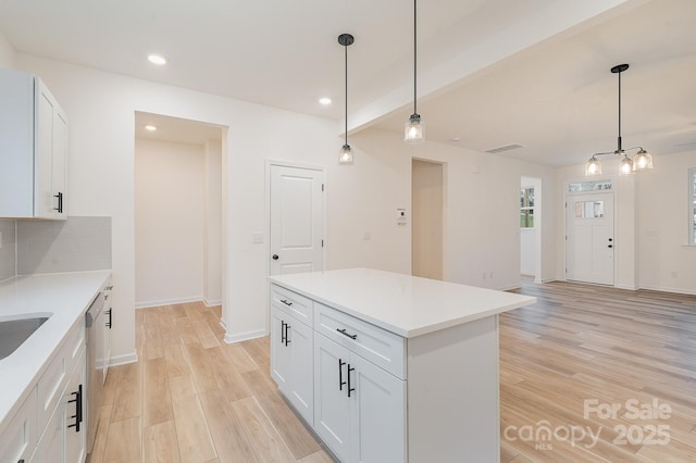 318 Sixth St, Belmont, NC 28012 - kitchen featuring light wood-type flooring, recessed lighting, light countertops, and white cabinetry