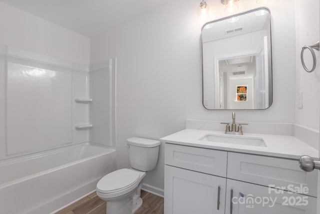 318 Sixth St, Belmont, NC 28012 - bathroom with vanity, wood finished floors, and bathing tub / shower combination