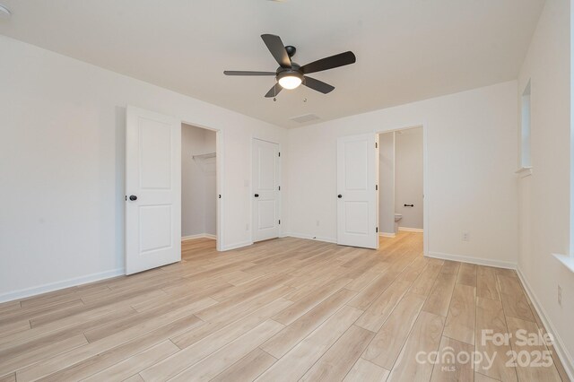 318 Sixth St, Belmont, NC 28012 - unfurnished bedroom featuring light wood-type flooring, ensuite bathroom, and a ceiling fan