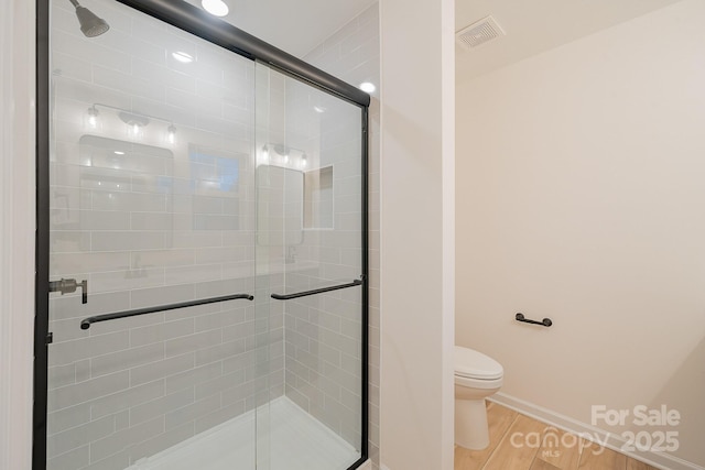 318 Sixth St, Belmont, NC 28012 - bathroom with a shower stall and wood finished floors