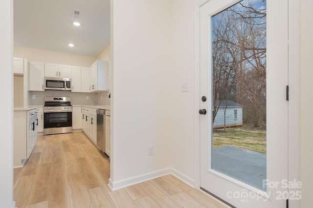 318 Sixth St, Belmont, NC 28012 - kitchen with appliances with stainless steel finishes, light wood-type flooring, light countertops, and recessed lighting