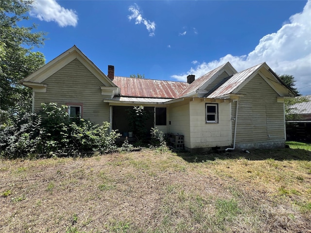 6268 Hudlow Rd, Union Mills, NC 28167 - rear view of property featuring a chimney, a metal roof, and a yard