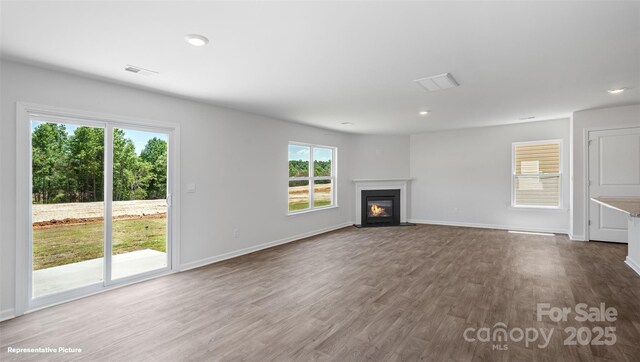 514 13th Avenue Dr NE, Hickory, NC 28601 - unfurnished living room featuring a fireplace with flush hearth, dark wood-type flooring, and recessed lighting
