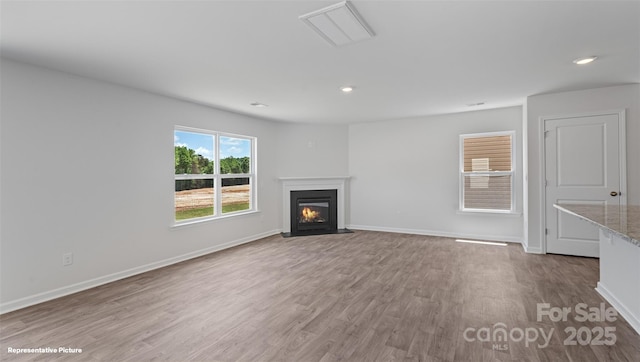 514 13th Avenue Dr NE, Hickory, NC 28601 - unfurnished living room featuring wood finished floors, a fireplace with flush hearth, and recessed lighting