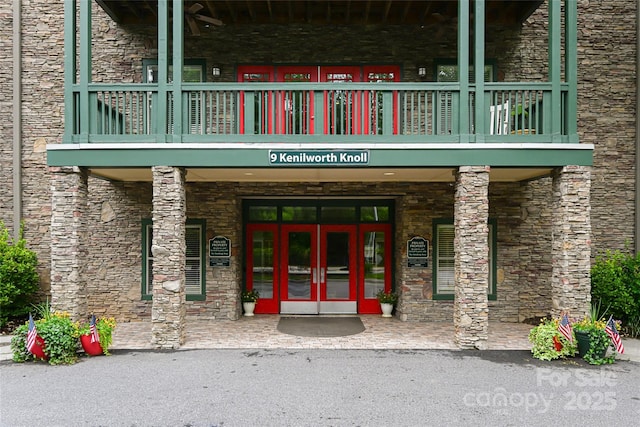 9 Kenilworth Knl, Asheville, NC 28805 - doorway to property featuring stone siding, french doors, and a balcony