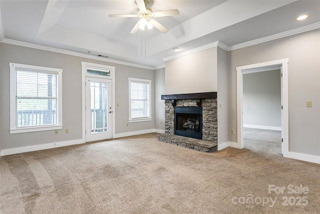 9 Kenilworth Knl, Asheville, NC 28805 - unfurnished living room featuring a tray ceiling, carpet, plenty of natural light, a ceiling fan, and ornamental molding