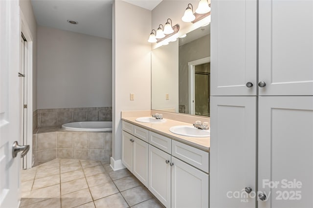 9 Kenilworth Knl, Asheville, NC 28805 - bathroom featuring double vanity, a garden tub, and tile patterned flooring