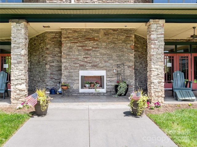 9 Kenilworth Knl, Asheville, NC 28805 - view of patio with an outdoor stone fireplace and french doors