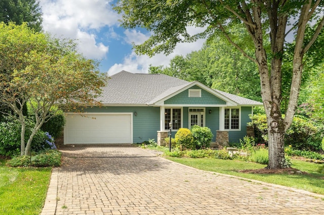 35 Stonecrest Ct, Flat Rock, NC 28731 - view of front of property with a garage, decorative driveway, and roof with shingles
