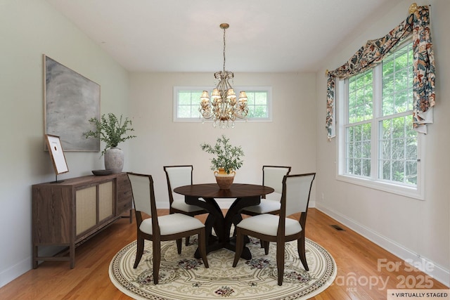 35 Stonecrest Ct, Flat Rock, NC 28731 - dining room featuring light wood-type flooring and a chandelier