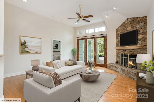 35 Stonecrest Ct, Flat Rock, NC 28731 - living area featuring a stone fireplace, a ceiling fan, wood finished floors, and high vaulted ceiling