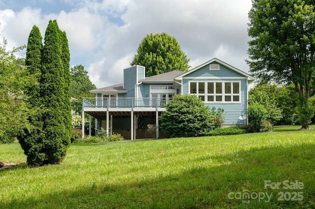 35 Stonecrest Ct, Flat Rock, NC 28731 - back of property with a wooden deck, a yard, and a chimney