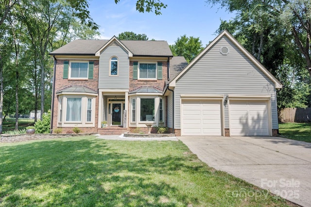 1045 Fairway Ridge Rd NW, Concord, NC 28027 - view of front of house with concrete driveway, an attached garage, and brick siding