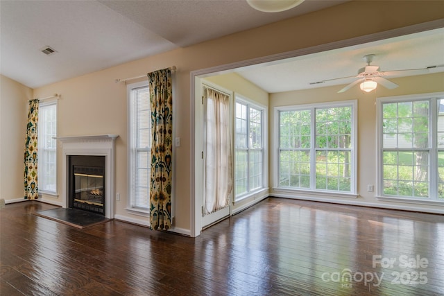 395 Running Briar Rd, Fletcher, NC 28732 - unfurnished living room featuring hardwood / wood-style floors, plenty of natural light, ceiling fan, and a glass covered fireplace