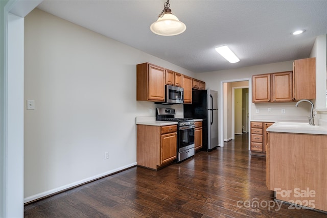 395 Running Briar Rd, Fletcher, NC 28732 - kitchen featuring appliances with stainless steel finishes, dark wood-type flooring, light countertops, pendant lighting, and recessed lighting
