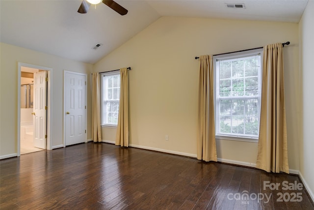 395 Running Briar Rd, Fletcher, NC 28732 - unfurnished bedroom with vaulted ceiling, wood finished floors, multiple windows, and connected bathroom