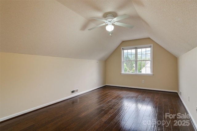 395 Running Briar Rd, Fletcher, NC 28732 - bonus room featuring dark wood-style floors, lofted ceiling, ceiling fan, and a textured ceiling