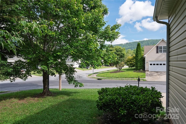 395 Running Briar Rd, Fletcher, NC 28732 - view of grassy yard featuring a garage and a mountain view