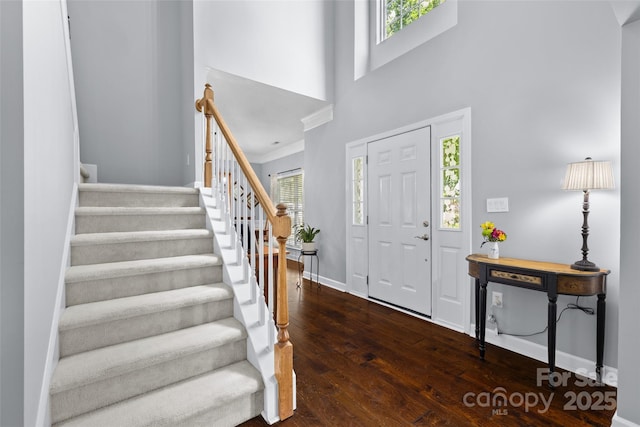 129 Nims Spring Dr, Fort Mill, SC 29715 - entrance foyer featuring plenty of natural light, stairs, wood finished floors, a towering ceiling, and ornamental molding