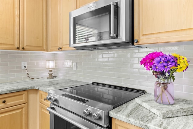 129 Nims Spring Dr, Fort Mill, SC 29715 - kitchen featuring appliances with stainless steel finishes, tasteful backsplash, and light countertops