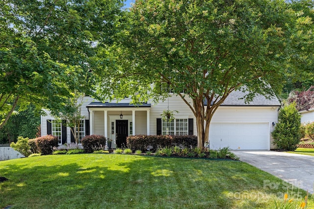 129 Nims Spring Dr, Fort Mill, SC 29715 - view of property hidden behind natural elements featuring an attached garage and concrete driveway