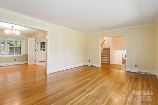 6921 Thermal Rd, Charlotte, NC 28211 - spare room featuring stairway, light wood-style flooring, and crown molding