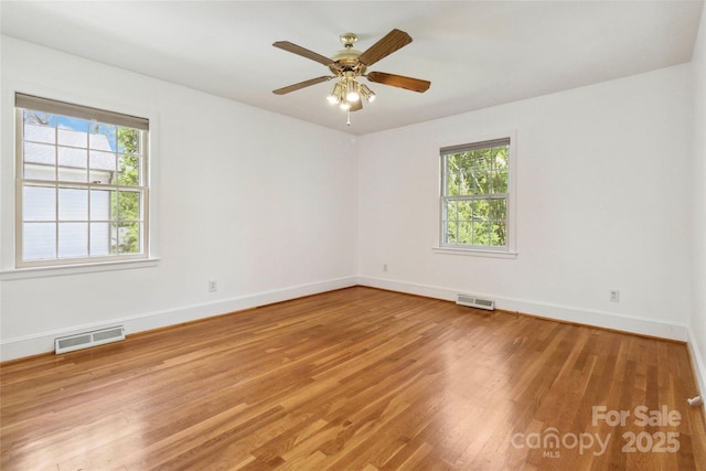 6921 Thermal Rd, Charlotte, NC 28211 - unfurnished room featuring healthy amount of natural light, wood finished floors, and ceiling fan
