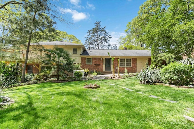 6921 Thermal Rd, Charlotte, NC 28211 - view of front of house featuring brick siding, a front lawn, and a chimney