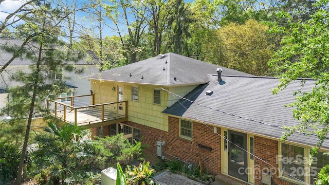 6921 Thermal Rd, Charlotte, NC 28211 - rear view of house with roof with shingles, brick siding, and a deck