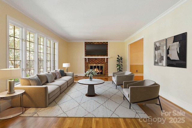 6921 Thermal Rd, Charlotte, NC 28211 - living room featuring wood finished floors, a brick fireplace, and ornamental molding