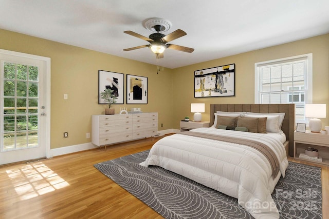 6921 Thermal Rd, Charlotte, NC 28211 - bedroom with multiple windows, access to outside, light wood-type flooring, and ceiling fan