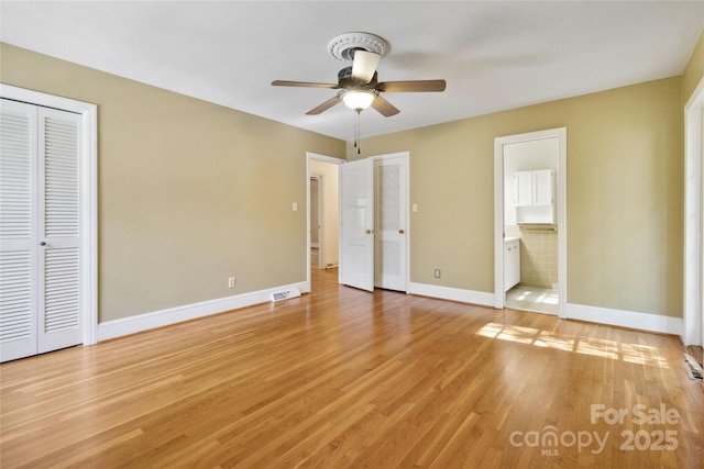 6921 Thermal Rd, Charlotte, NC 28211 - unfurnished bedroom with light wood-type flooring, ensuite bathroom, and a ceiling fan