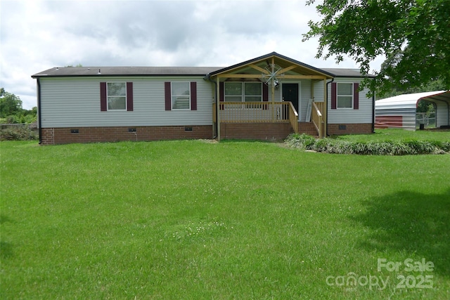 236 Boxwood Church Rd, Mocksville, NC 27028 - manufactured / mobile home with crawl space, a porch, a front yard, and a detached carport
