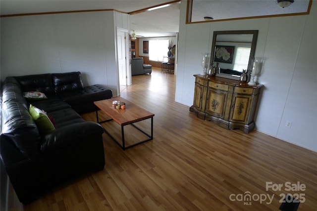 236 Boxwood Church Rd, Mocksville, NC 27028 - living room with wood finished floors, crown molding, and a decorative wall