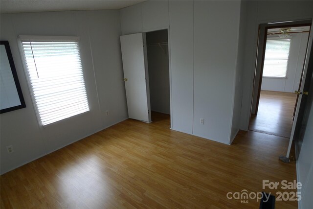 236 Boxwood Church Rd, Mocksville, NC 27028 - unfurnished bedroom featuring light wood-style flooring and a closet