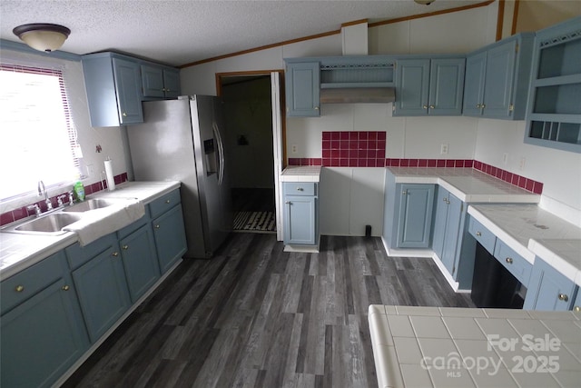 236 Boxwood Church Rd, Mocksville, NC 27028 - kitchen featuring open shelves, tile counters, blue cabinetry, a textured ceiling, and lofted ceiling